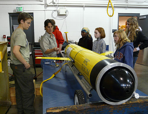 Katie Rathmell teaches a  group of high school students about the glider.