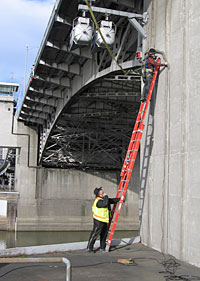 Jami Goldman installing cabling for river sensor.