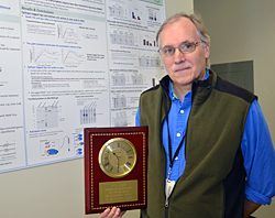 Peter Zuber holding Jack Kenney Award